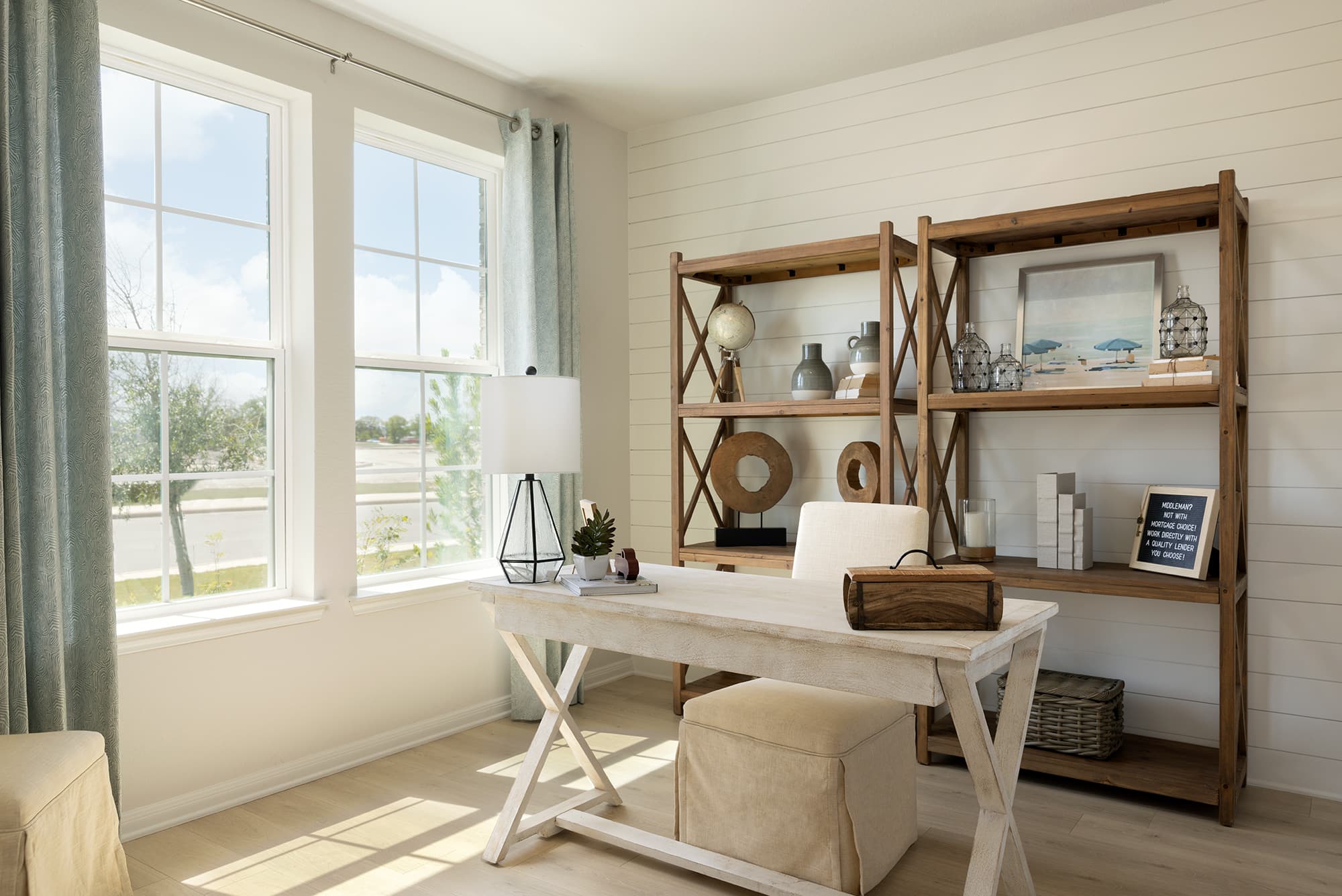 study with a desk, windows & wooden displays 