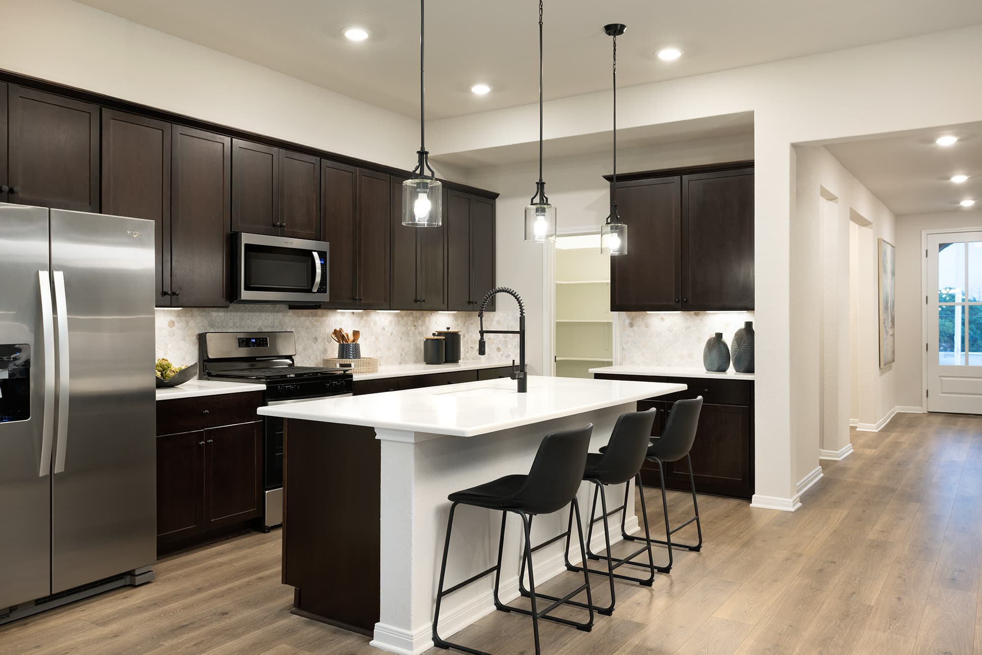 kitchen with brown flooring & white countertops