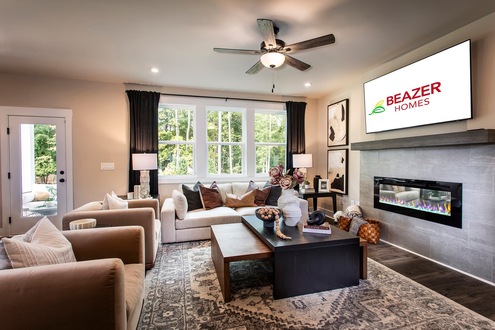 great room with fireplace and plank flooring
