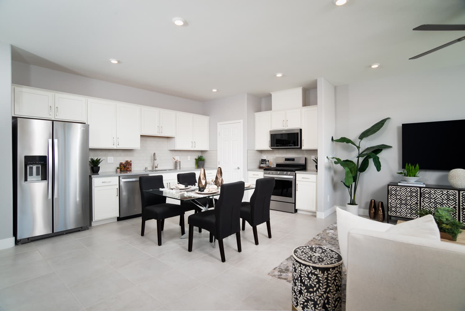 kitchen with stainless appliances & white cabinets
