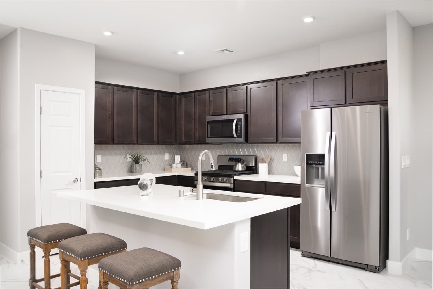 light-filled kitchen with granite & wood cabinets