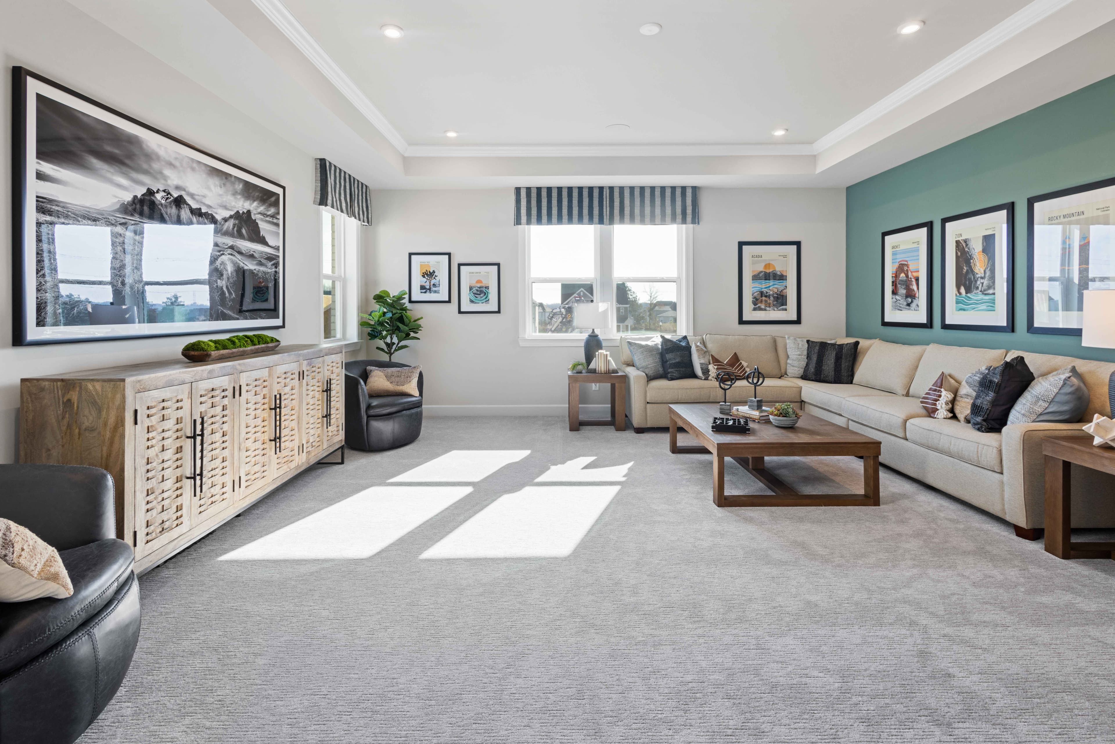 bonus room with tray ceiling and large windows