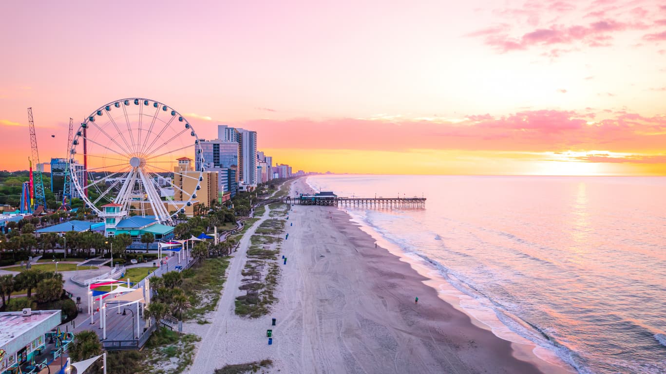 ocean and sky wheel with sunset in the background