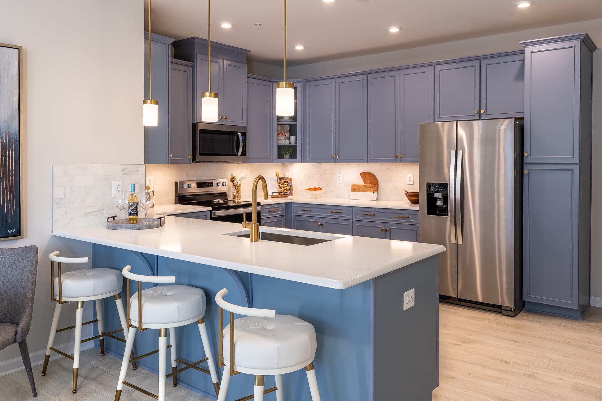 kitchen with blue cabinets and a breakfast bar