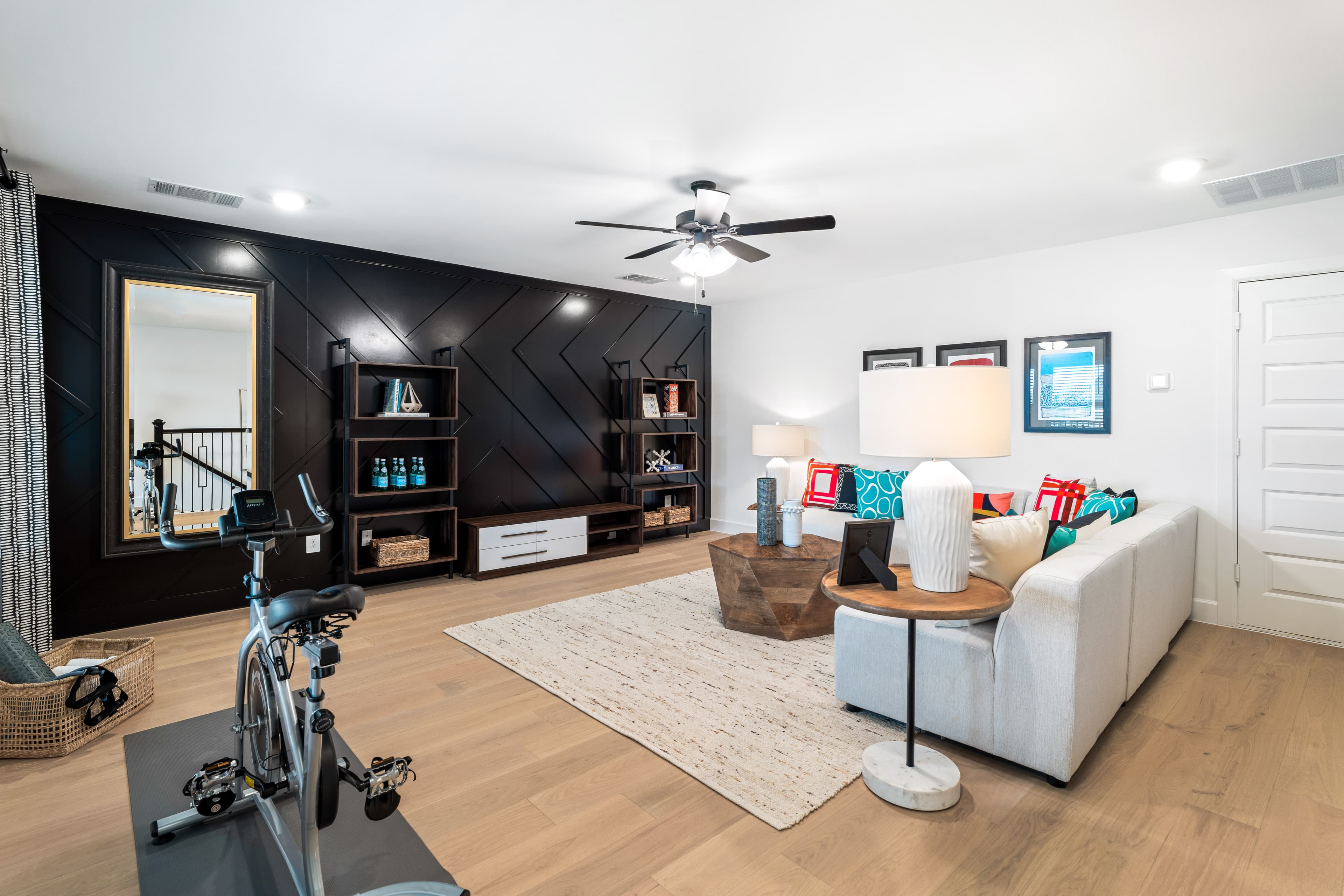 loft with large windows and light hardwood floors