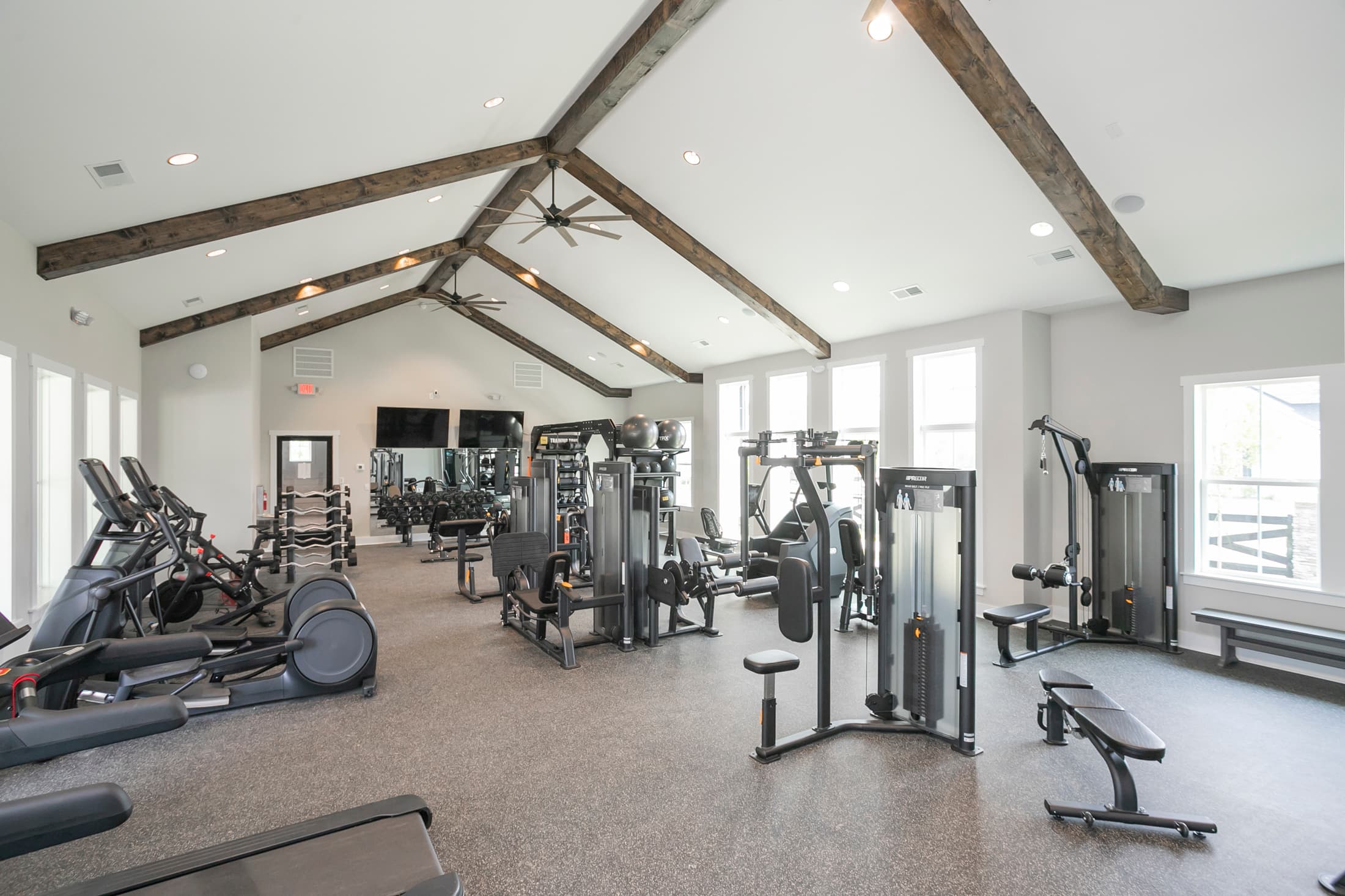 equipment room with workout machines and weights