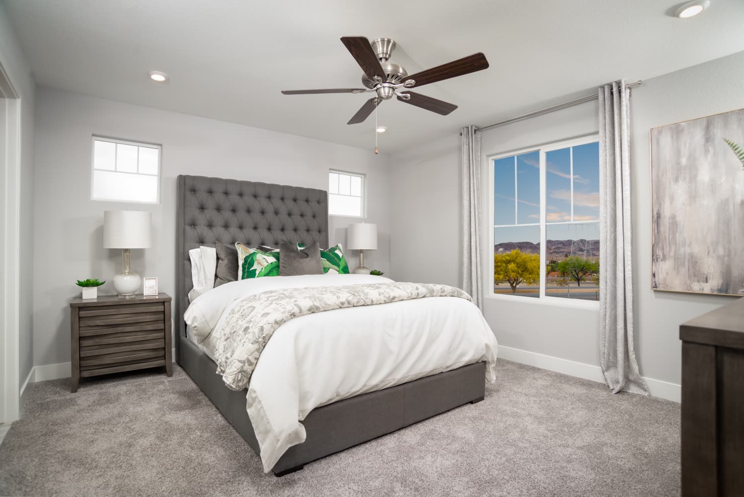 primary bedroom with carpet floors and ceiling fan