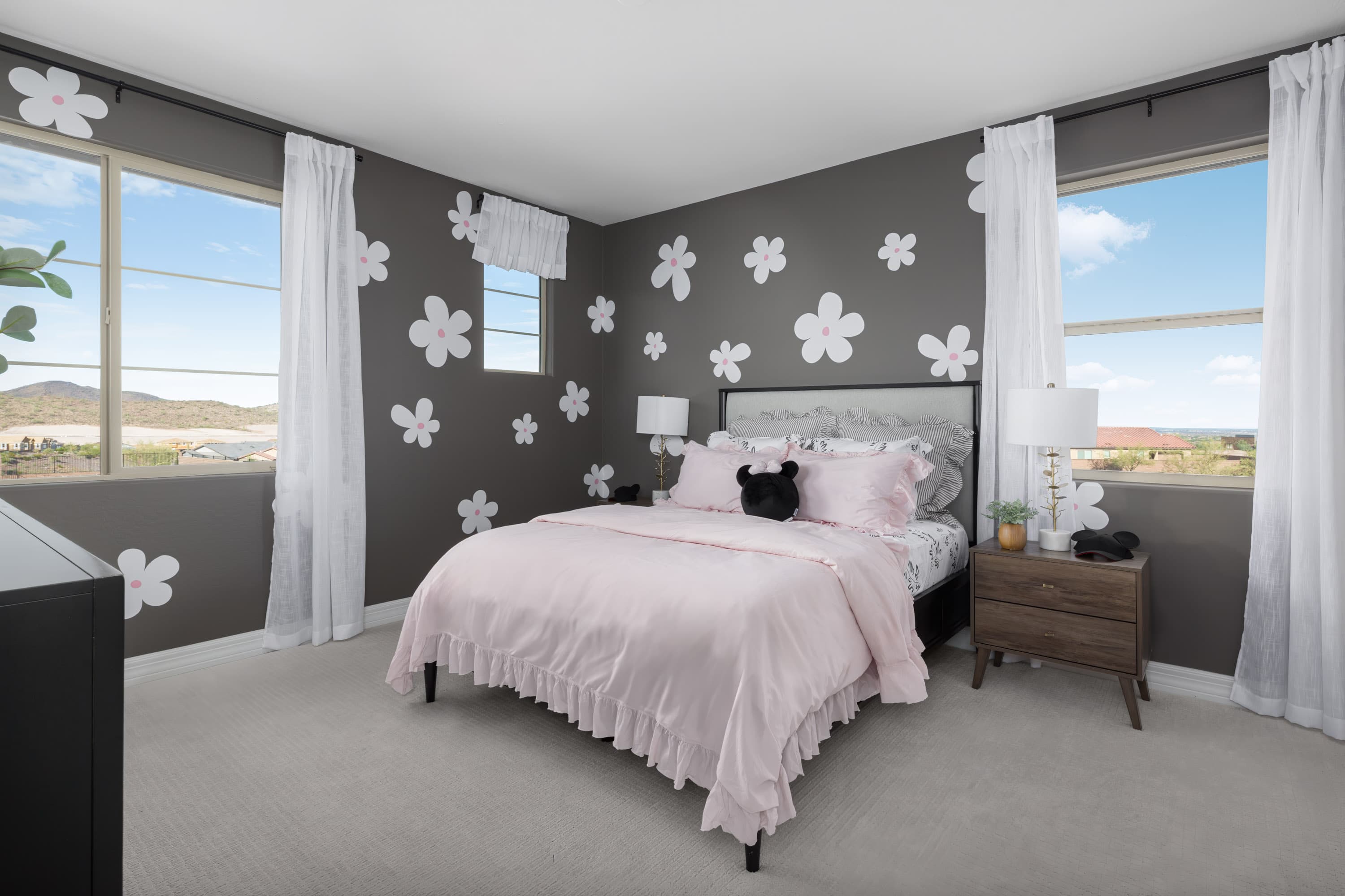 bedroom with wall art and window
