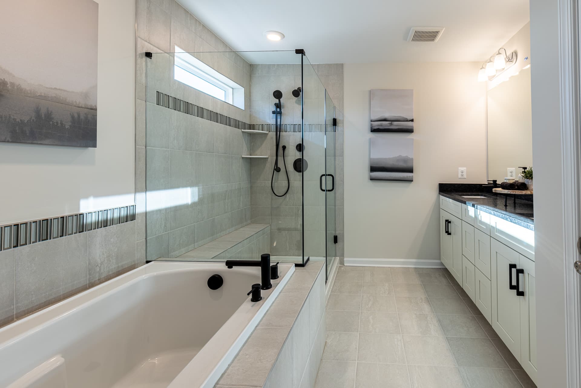 primary bath with a separate soaking tub & shower