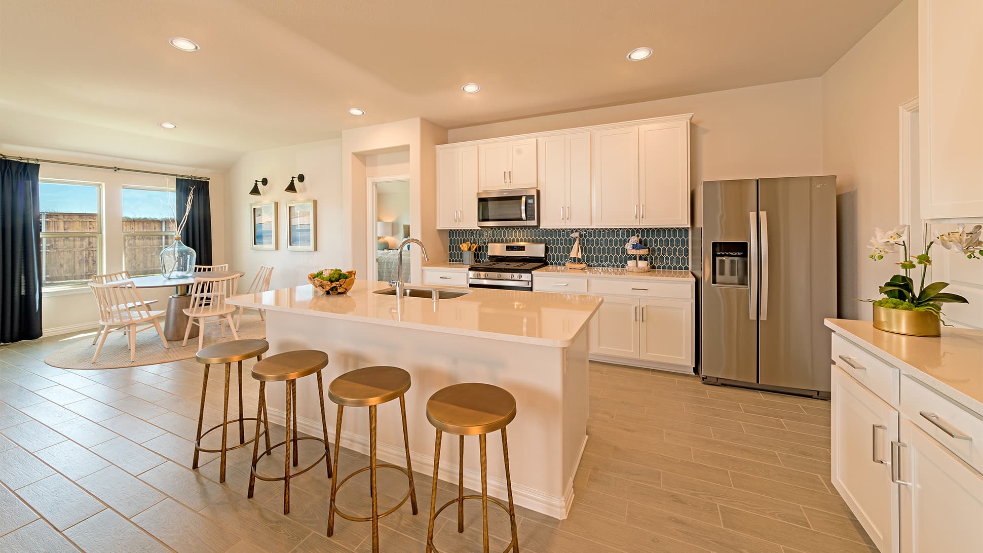 open kitchen with tile floors and large island