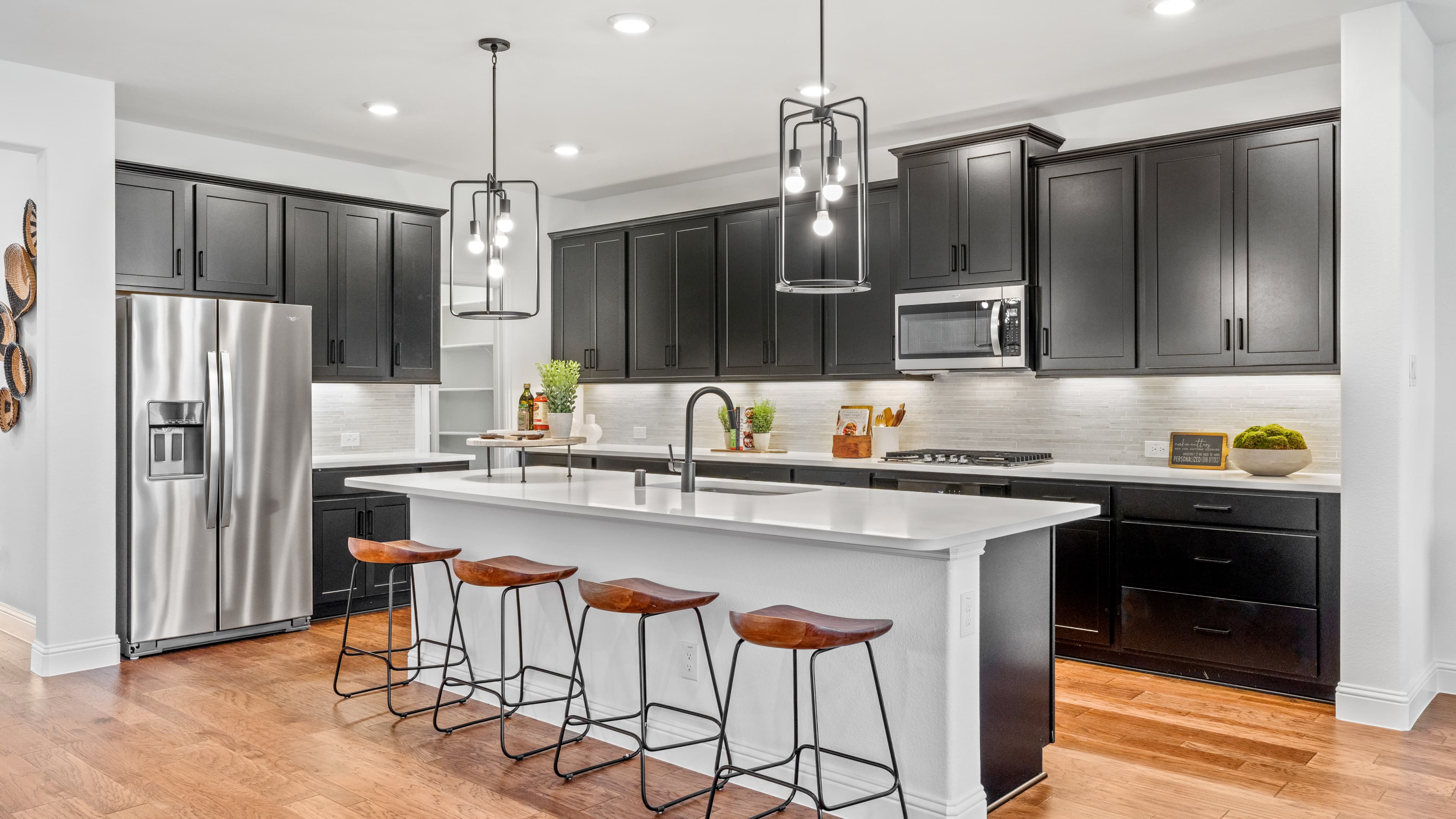 open kitchen with large island and wood floors