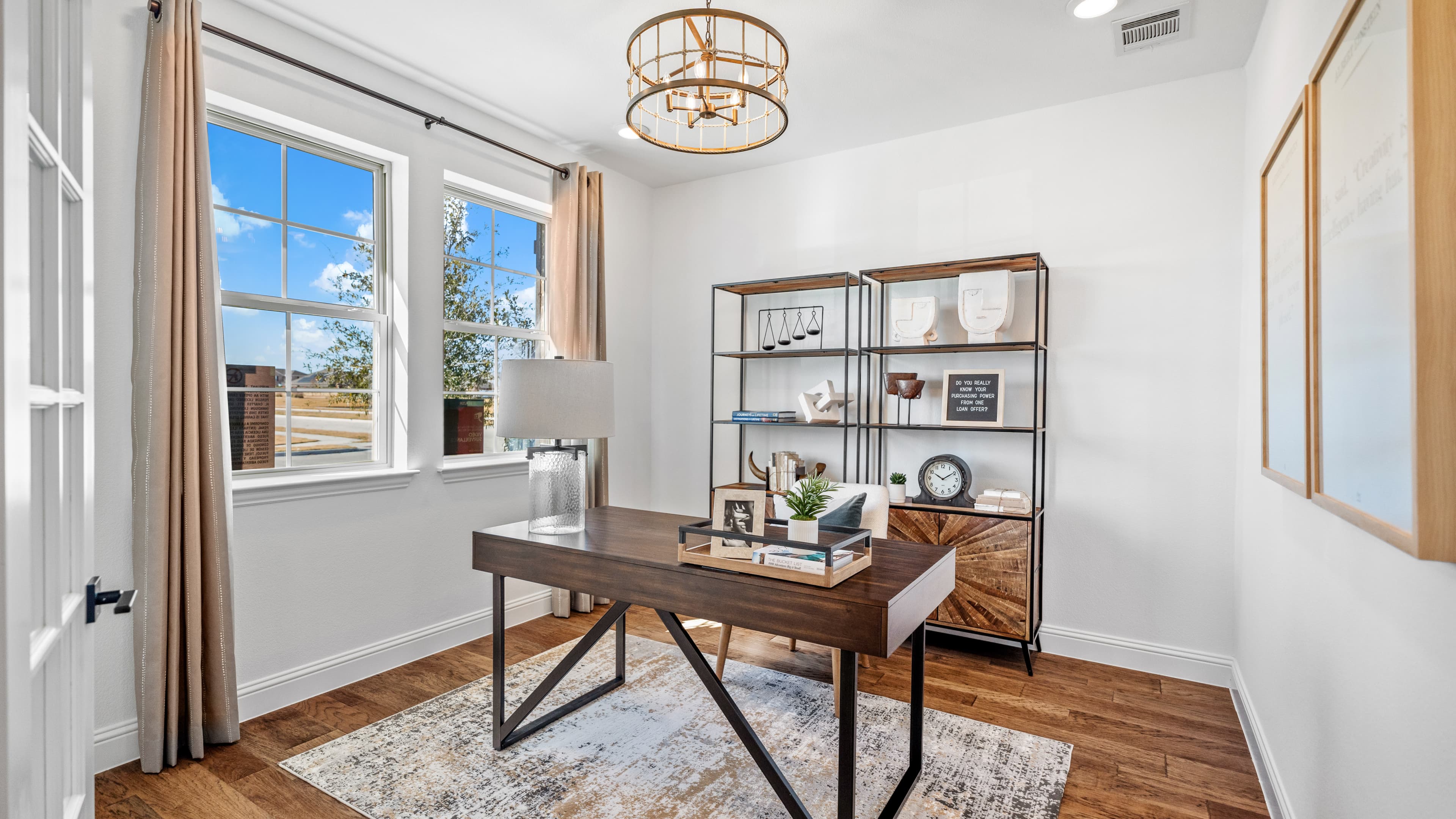 study with white glass doors and wood floors