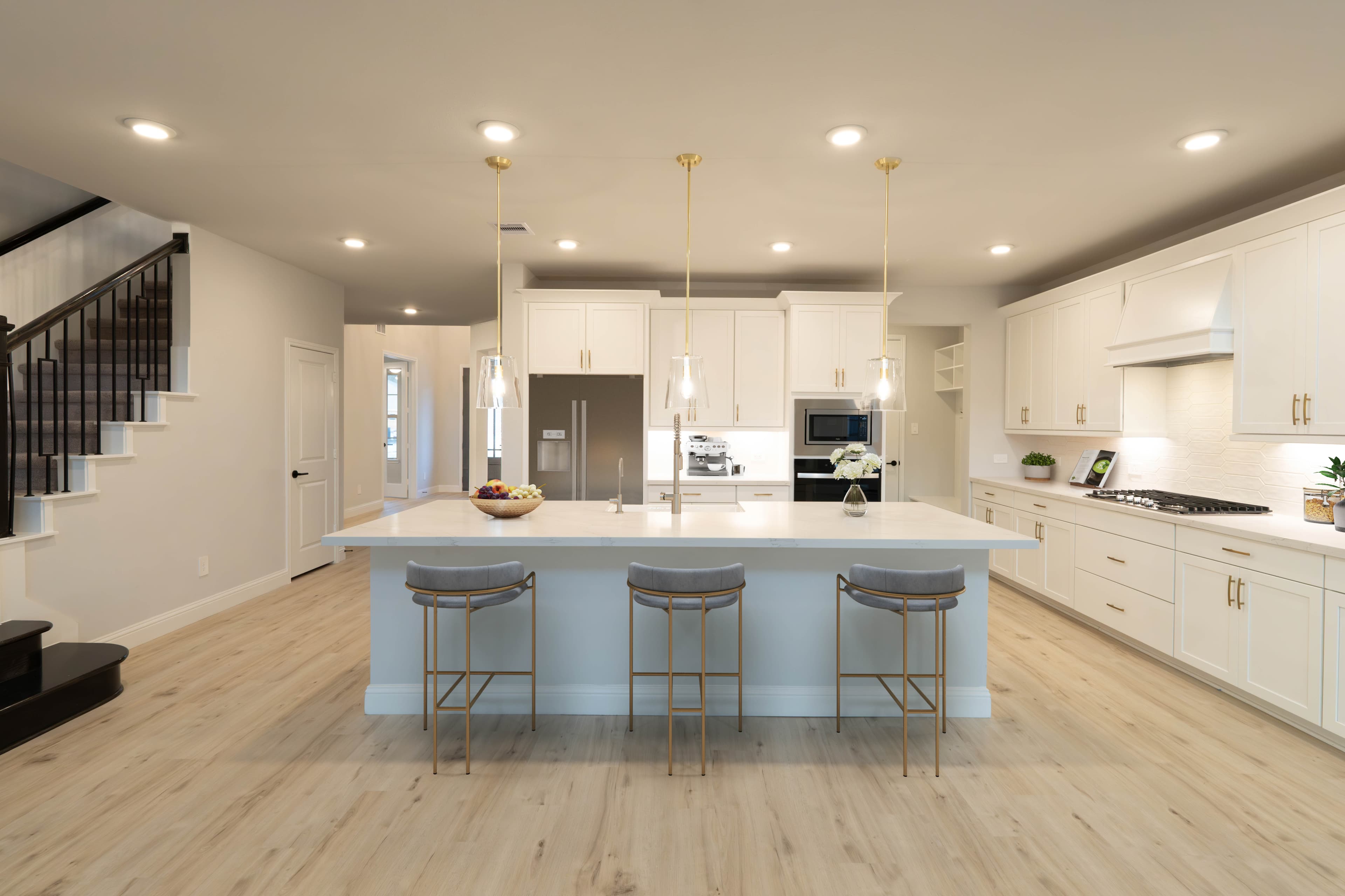 kitchen with white cabinets and gold hardware