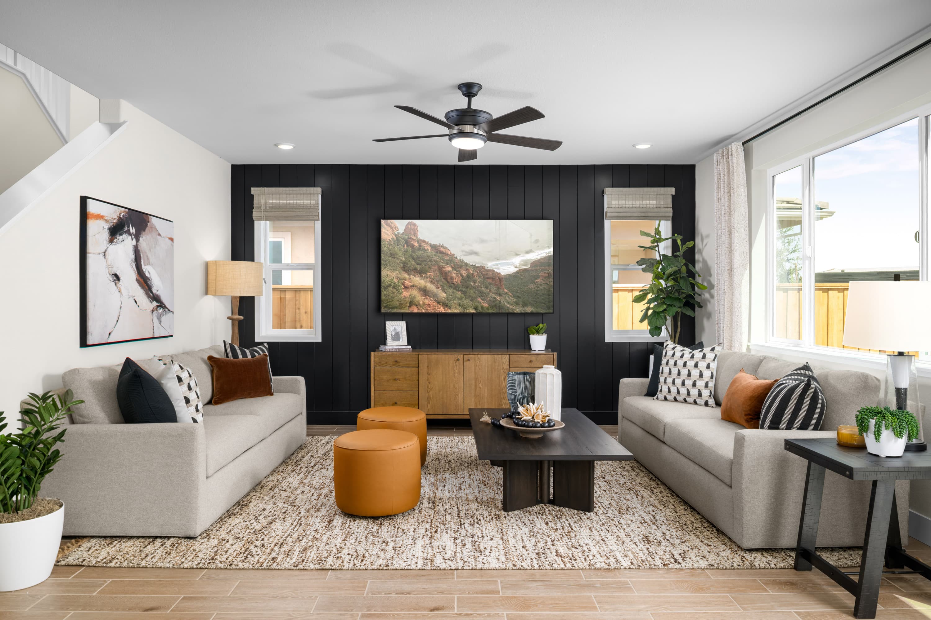 great room with neutral sofas and accent wall