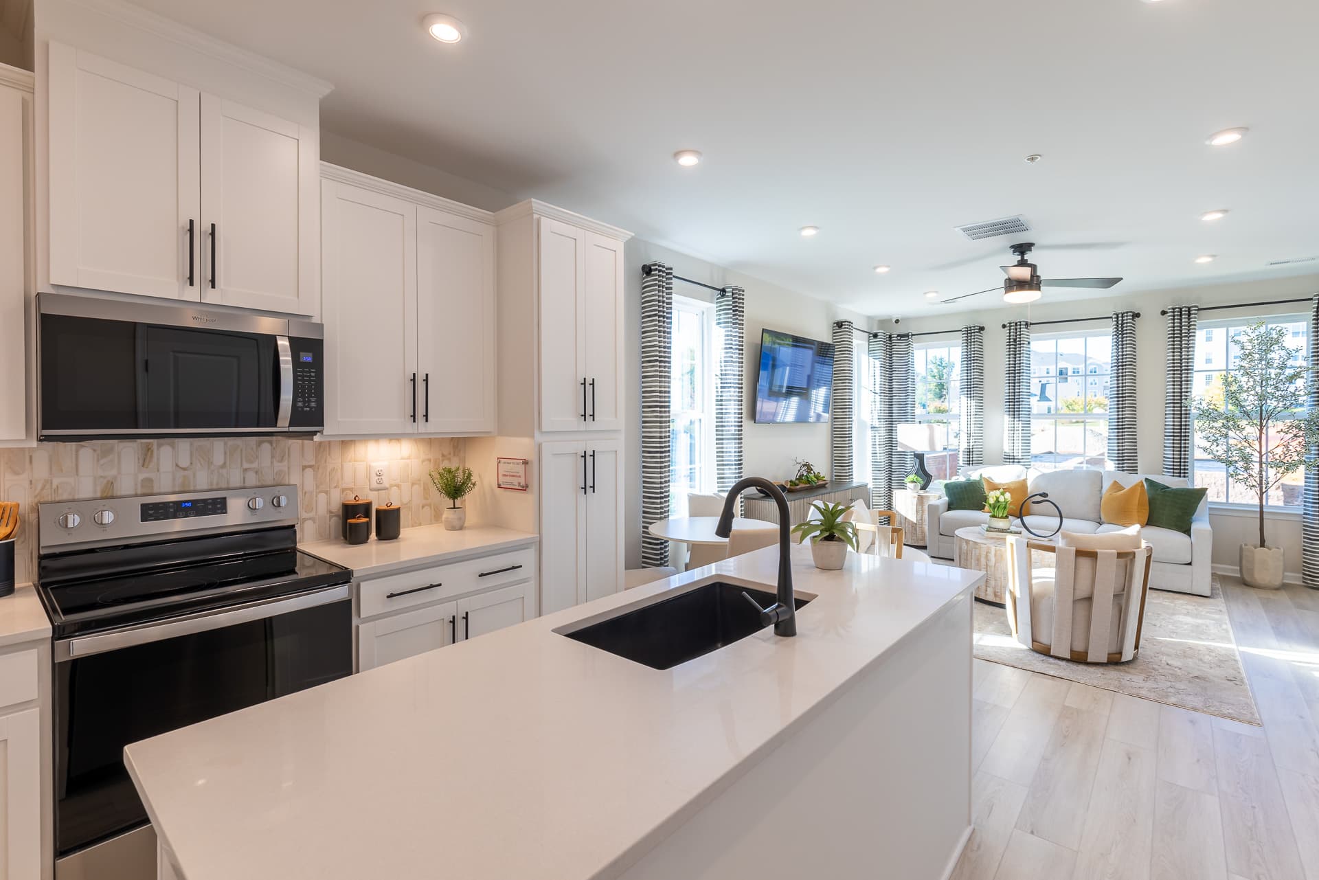 kitchen extending to the great room letting in an abundance of natural light